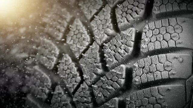 Super Slow Motion of Falling Snow on Tire Sample, Close-up, Free Space for Text. Filmed on High Speed Cinema Camera, 1000 fps.