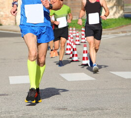 Fototapeta na wymiar senior runner in sports outfit during foot race