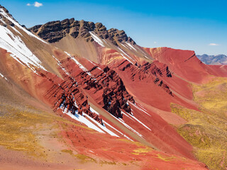 Stunning view of the Red Valley (valle rojo) with splashes of snow on the colored rocks, Cusco region, Peru - 684160572