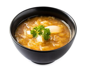 Onion soup in black bowl isolated on white background, cut out