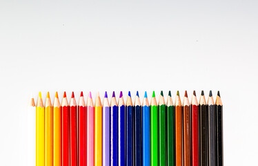 A Vibrant Array of Colorful Pencils in Perfect Alignment