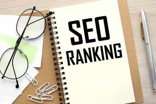 SEO RANKING open notepad with text. glasses on a notepad.