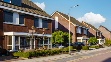 Dutch Suburban area with modern family houses, newly built modern family homes in the Netherlands,...