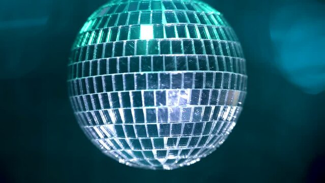Blue disco ball. Blue disco ball background. Blue disco ball with rays rotate. 