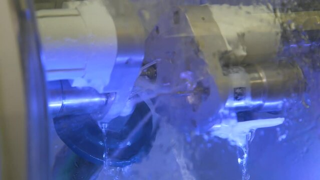 Fabrication of dental crowns and dentures made of ceramic. The milling machine cuts the ceramic dental crown from the workpiece.