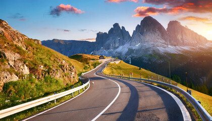 mountain road beautiful asphalt road in the evening incredible summer day vintage toning highway in mountains pass giau dolomites alps italy popular travel and hiking destination - obrazy, fototapety, plakaty