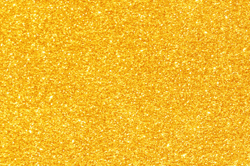 Golden yellow light glitter bokeh texture background.  New Year, Christmas and all celebration...