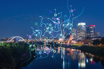 Panoramic view of Broadway district of Nashville over River at illuminated night, Tennessee, USA....