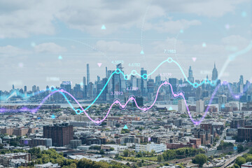 Aerial helicopter view of midtown New York City form Jersey. Financial district and residential neighborhood. Forex candlestick graph hologram. The concept of internet trading, brokerage, analysis