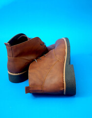 man half boots on a blue background - 684192995