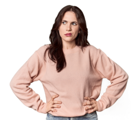 Young Caucasian woman in a studio setting confused, feels doubtful and unsure.