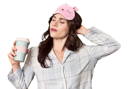 Young Caucasian in pajamas with to-go coffee in studio