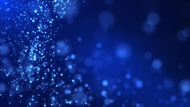 Magic blue particles seamlessly flowing with bokeh effect surrounded by soft light. New Year and Christmas background of glowing particles. Frozen snowflakes on blur background. Holidays, events. 4k. 