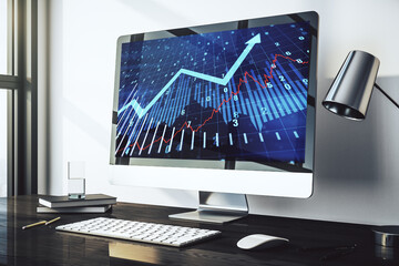 Computer monitor with abstract creative financial graph and upward arrow, financial and trading...