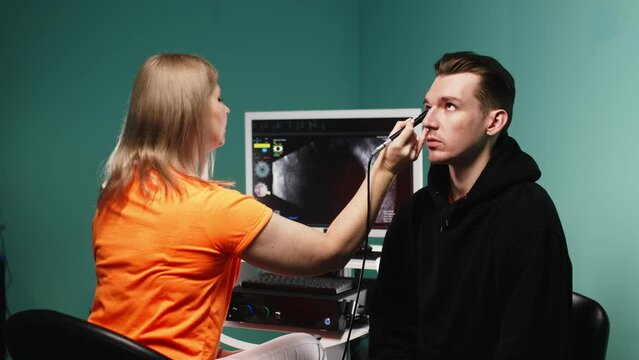 An ophthalmologist performs a precise ultrasound of the eyes (B-scan) for an in-depth examination of the eyes in a clinical setting. Medical technology concept for ophthalmic services.