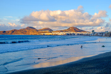 View on the beach Las Canteras at sunset in Las Palmas de Gran Canaria, Canary Islands, Spain.