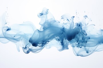 Blue ink in water on white background close-up, abstract background.