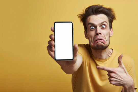 A man with strange facial expressions shows a phone to mocks with a white screen on a yellow background. ai generative