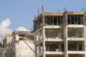 close-up of multi-storey building construction and safety nets,