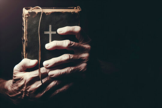 Old book bible in the hands of an old man closeup on dark background with point light on it. ai generative