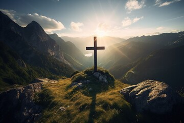 Wooden cross on the top of the mountain with clouds on the background