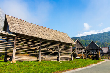 Fototapeta na wymiar Bohinjska, Slovenia. 10-01-2023. Old hay dryer called Kozolec in Slovenia