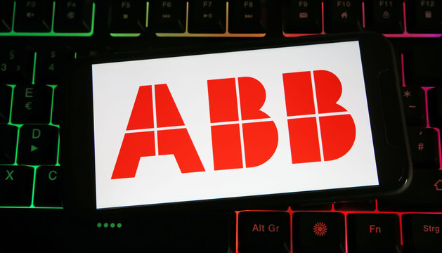 Viersen, Germany - July 9. 2023: Closeup of mobile phone on computer keyboard with logo lettering of ABB company