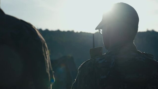 Soldier From Behind in the Shot With Sun Rays