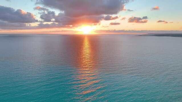 Slow motion of large waves of the Atlantic Ocean illuminated by sunset light. Cinematic drone of sunset over the sea. aerial view.