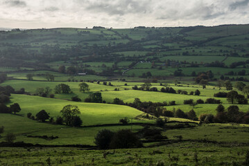 Fototapeta na wymiar Beautiful wide vista landscape image of English countryside in Peak District National Park late afternoon early Autumn