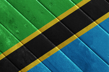 Flag of United Republic of Tanzania on a textured background. Concept collage.