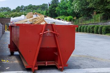 Fototapeta na wymiar Container trash dumpster is used for recycling of construction waste in caring environment with solid household waste
