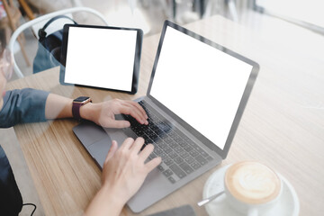 A blank screen for hand typing text,using laptop and tablet  contact business searching information in workplace on desk at office.