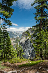 Steep Cliff Walls Are Framed By Tall Pines On Crocker Point In Yosemite