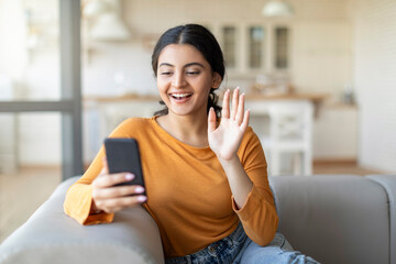 Online Communication. Happy Indian Woman Making Video Call Via Smartphone At Home