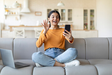 Video Call. Happy Indian Woman Teleconferencing Via Smartphone At Home