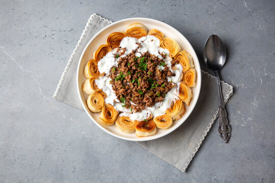 Turkish Manti with Yogurt, Minced Meat and Fried Butter Sauce From Artvin called Silor - Siron - Ziron Rolled Raw Dough and Fried Phyllo -Manlama with Dill