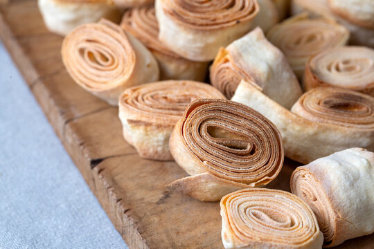 Turkish Food From Artvin called Silor - Rolled and Fried phyllo. Silor on blue plate.