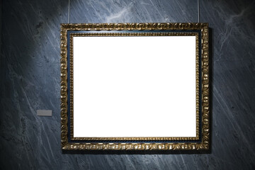 In an art museum, a picture frame with an empty canvas hangs on the wall