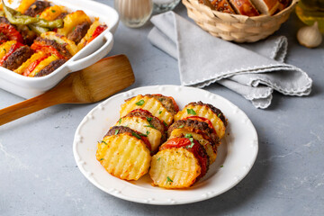 Traditional Turkish food; baked potatoes and meatballs. Turkish name; kofteli patates dizmesi, patates dizme