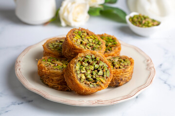 Traditional Turkish desserts; Kadaif stuffed with pistachios. Turkish name; Kadayif dolmasi or dolma kadayif. Halep sarma, halep sarmasi.