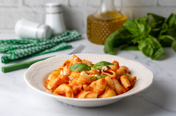 Tomato ravioli pasta or pipe rigate shaped pasta on the cheese
