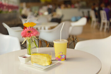 Cake and flowers in a vase