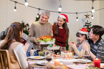 Asian family celebrating christmas party dinner
