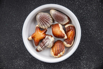 candy seashell chocolate sweet dessert delicious eating appetizer meal food snack on the table copy space food background rustic top view