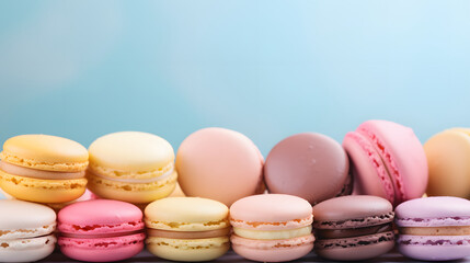 Obraz premium Macaroons Background with a place to copy, pastel colors. Delicious dessert. Cookies, pastries, flour products.
