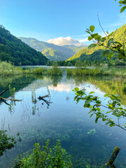 Scenic view of a lake in the mountains on a sunny day in Adjara, Georgia.