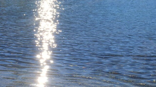 Ripples on a Blue Mountain Lake Water Surface on a Sunny Day