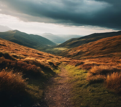 A beautiful landscape with a path leading through the hills and valleys under a dark and cloudy sky, creating a dramatic mood.