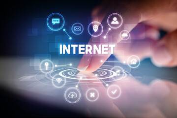 Finger touching tablet with web technology icons concept